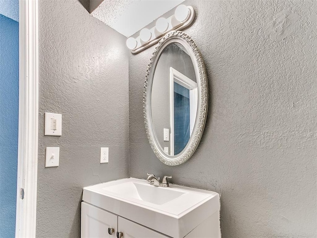 bathroom featuring vanity and a textured ceiling