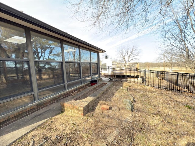 view of yard with a rural view