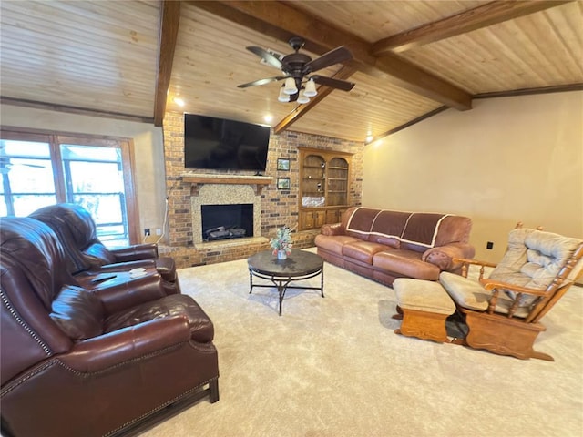 carpeted living room with lofted ceiling with beams, ceiling fan, built in features, and a fireplace