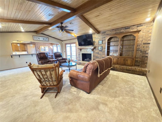 living room with light colored carpet, lofted ceiling with beams, and a brick fireplace