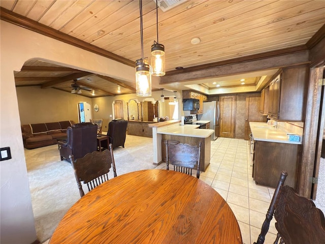 dining room with vaulted ceiling with beams, light tile patterned floors, ceiling fan, crown molding, and wooden ceiling