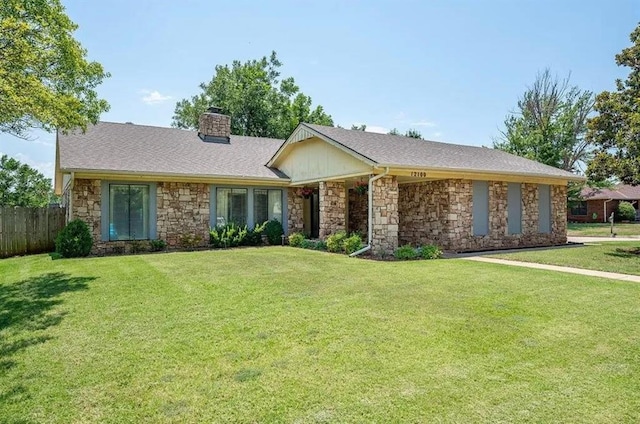 single story home with a front lawn