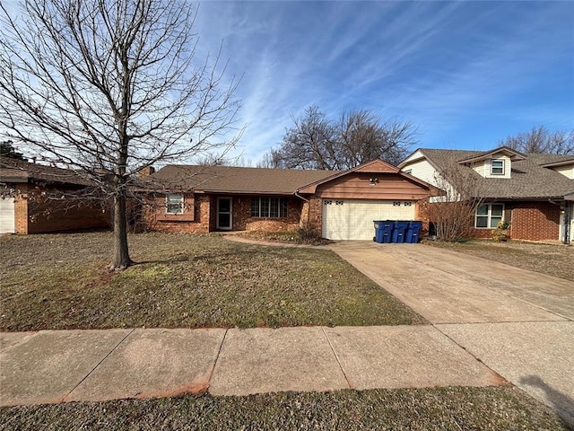 single story home featuring a garage and a front lawn