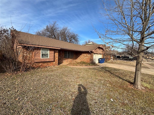 view of front of property with a garage and a front yard