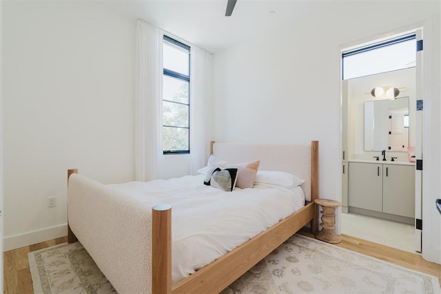 bedroom featuring ceiling fan and light wood-type flooring