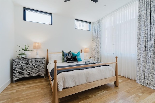 bedroom featuring ceiling fan and wood-type flooring