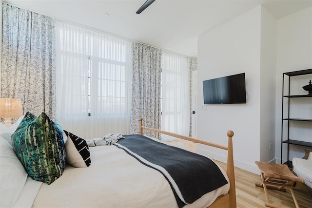 bedroom featuring wood-type flooring and ceiling fan