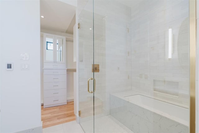 bathroom featuring shower with separate bathtub and tile patterned floors