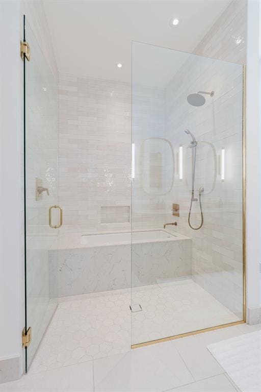 bathroom featuring tile patterned flooring and plus walk in shower