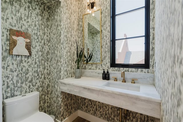 bathroom featuring sink and toilet