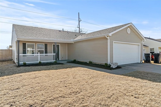 ranch-style home with a shingled roof, a garage, driveway, and covered porch