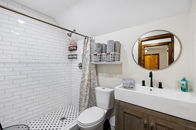 bathroom featuring a shower with curtain, vanity, toilet, and vaulted ceiling