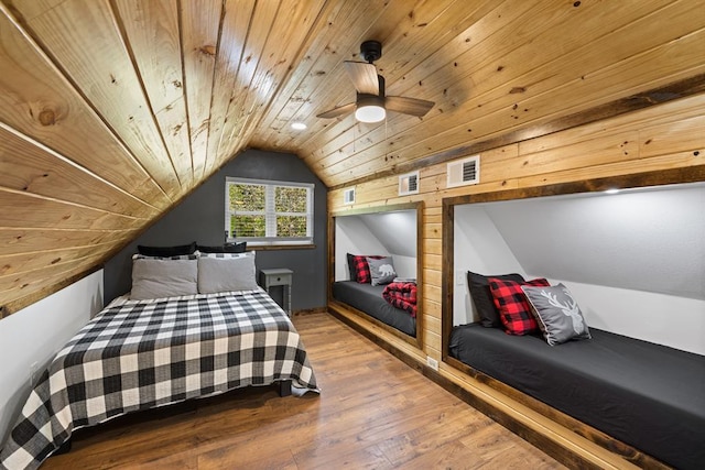 bedroom featuring ceiling fan, lofted ceiling, hardwood / wood-style floors, and wood ceiling