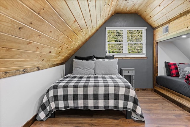 bedroom featuring wood-type flooring, vaulted ceiling, and wooden ceiling