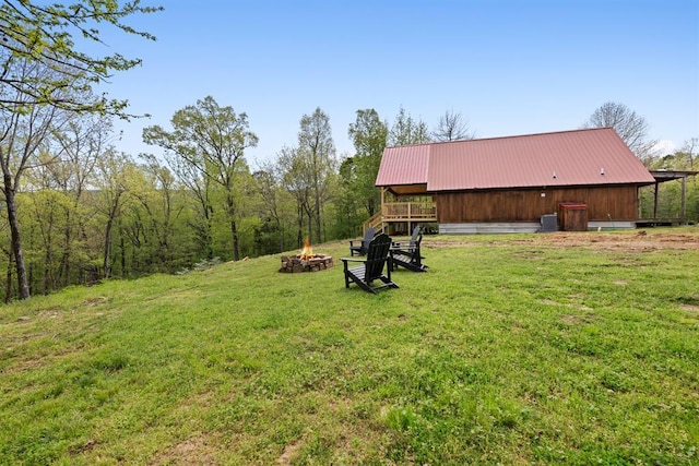 view of yard with an outdoor fire pit