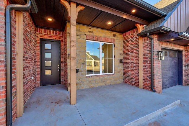 entrance to property featuring a garage