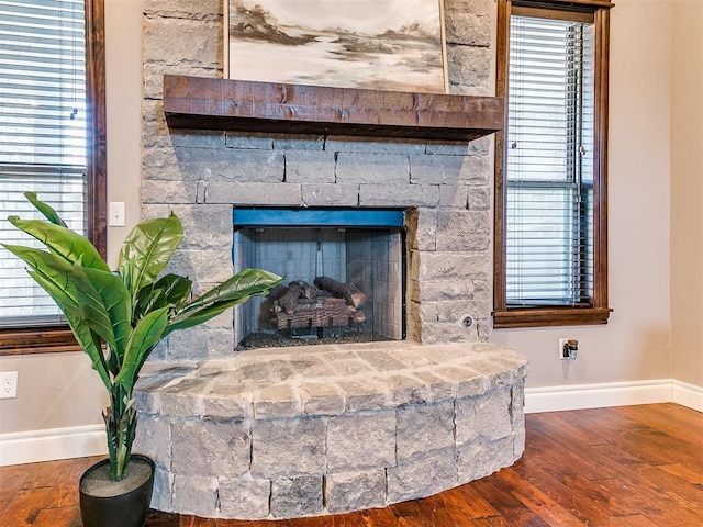 room details featuring wood-type flooring and a fireplace