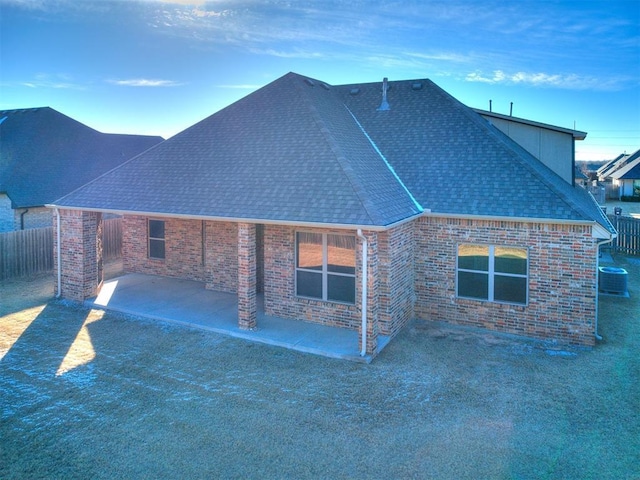 view of home's exterior with a patio and central AC