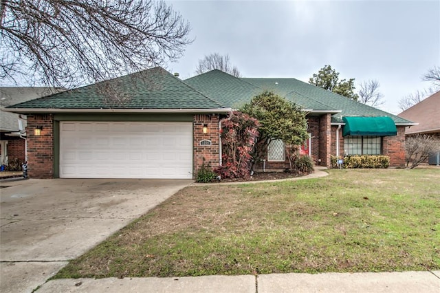 ranch-style house featuring a garage and a front yard