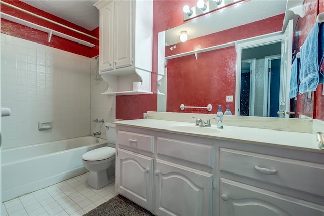 full bathroom featuring tile patterned floors, toilet, tiled shower / bath combo, and vanity