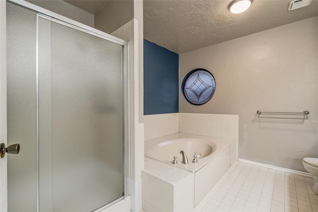 bathroom featuring independent shower and bath, tile patterned floors, a textured ceiling, and toilet