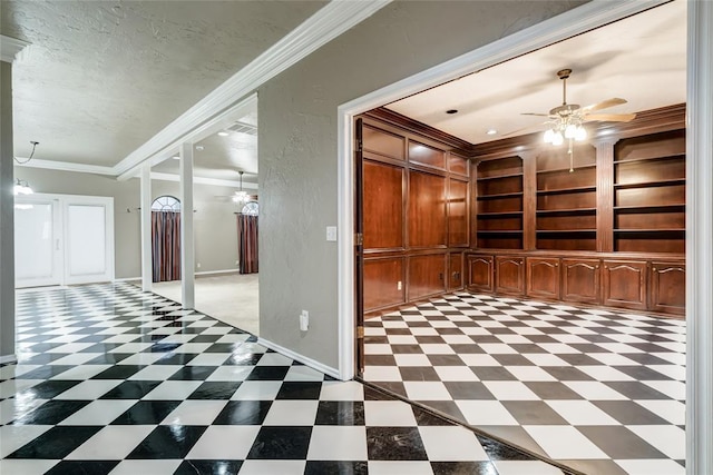 corridor featuring crown molding, built in features, and a textured ceiling