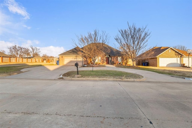 ranch-style home featuring a garage