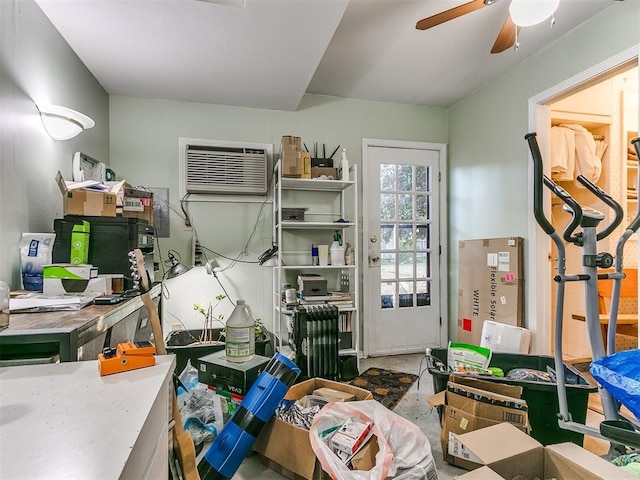 miscellaneous room with ceiling fan and a wall mounted AC