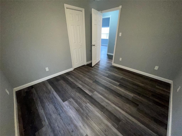 spare room featuring dark hardwood / wood-style flooring