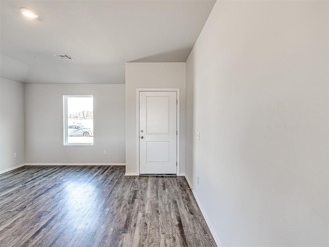 empty room featuring wood-type flooring