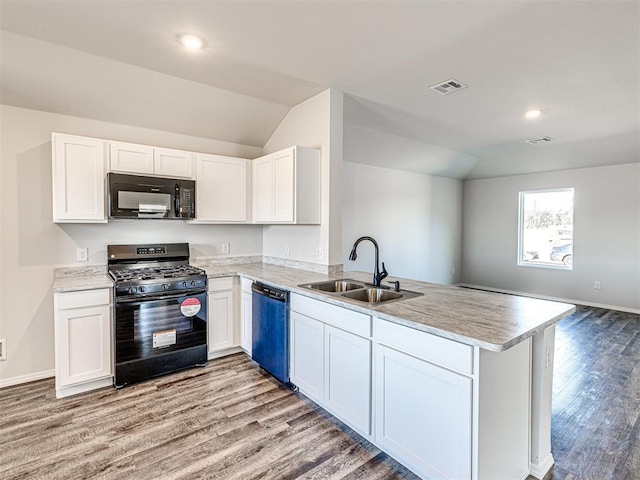 kitchen featuring sink, kitchen peninsula, white cabinets, and black appliances