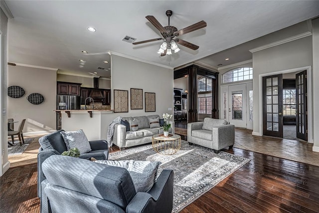 living room featuring sink, ceiling fan, ornamental molding, dark hardwood / wood-style flooring, and french doors