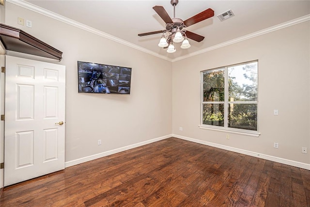 empty room with crown molding, dark hardwood / wood-style floors, and ceiling fan