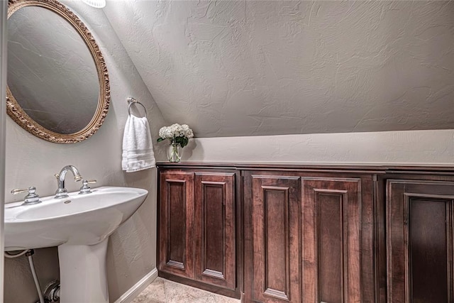 bathroom with sink and a textured ceiling