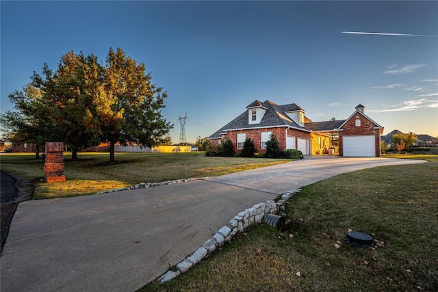 view of front facade featuring a yard and a garage