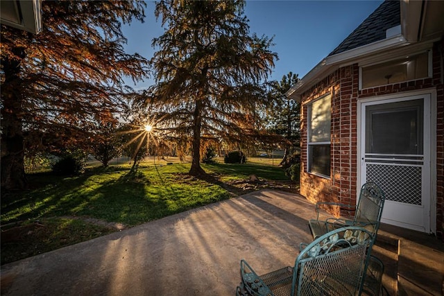 patio terrace at dusk with a lawn