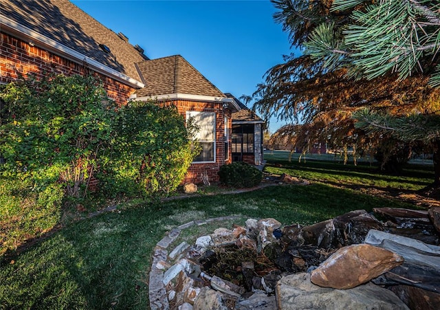 view of yard with a sunroom