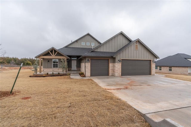 craftsman inspired home featuring a garage and a front yard