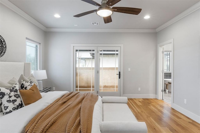 bedroom featuring crown molding, ceiling fan, and light hardwood / wood-style floors