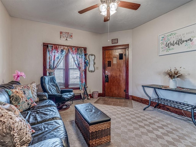 carpeted living room with ceiling fan and a textured ceiling