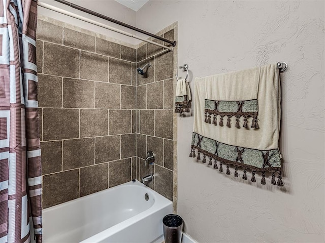 bathroom with shower / bath combination with curtain