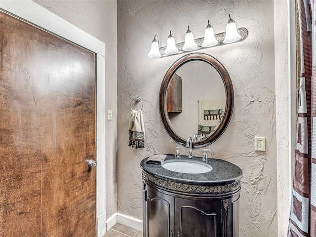 bathroom with vanity and tile patterned flooring