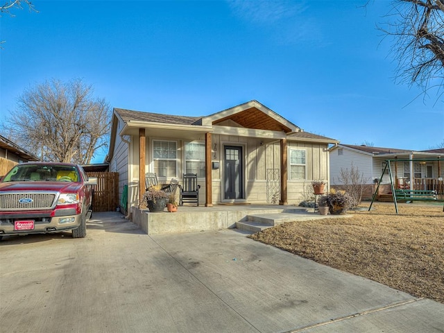 view of front of property with a carport and covered porch