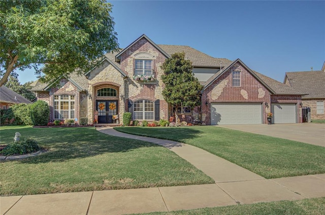 view of front of home with a garage and a front yard