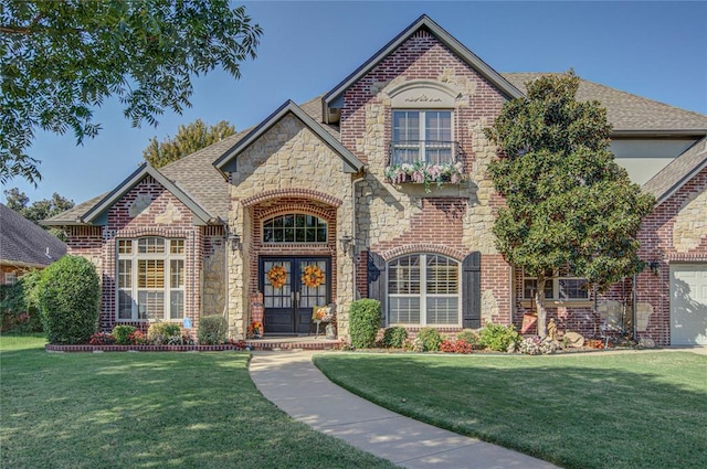 view of front of house with a front lawn and french doors