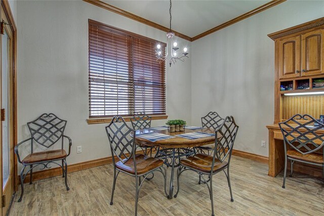 dining area featuring an inviting chandelier, ornamental molding, and light wood-type flooring