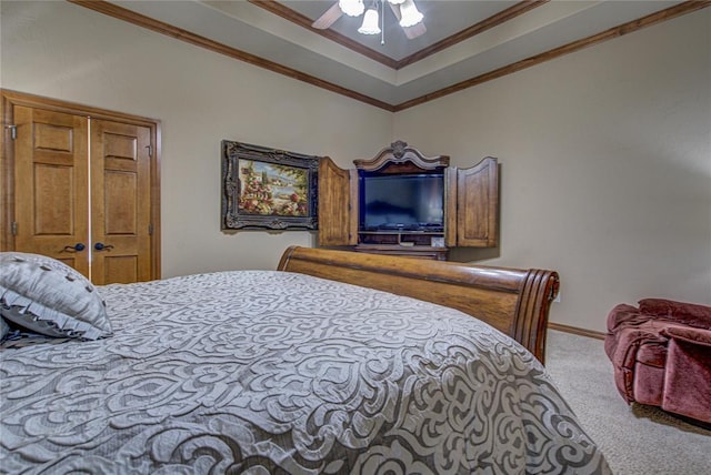 carpeted bedroom featuring crown molding and ceiling fan