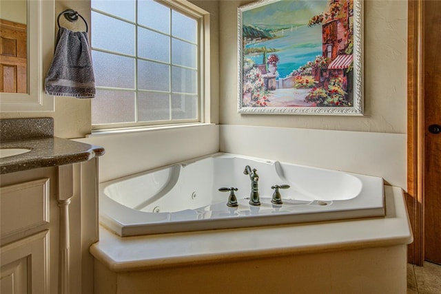 bathroom with vanity and a tub to relax in