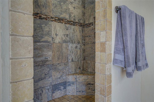 bathroom with a tile shower