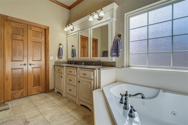 bathroom with tile patterned floors, vanity, ornamental molding, and a tub